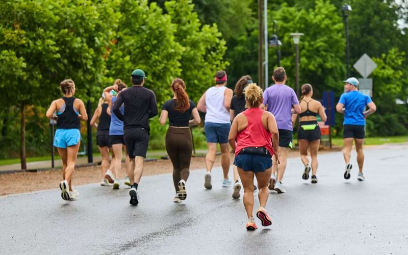 a group of people running on a road