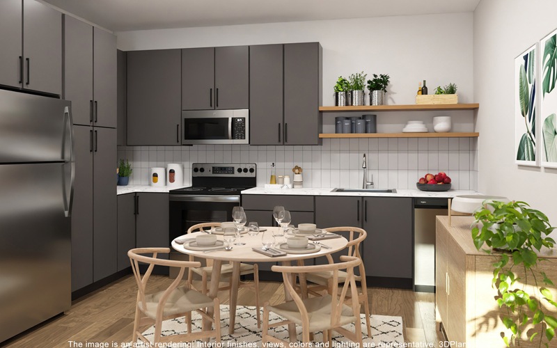 kitchen with grey cabinets and a table with chairs