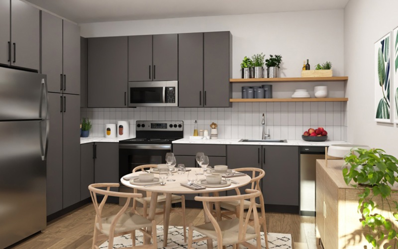 kitchen with grey cabinets and a table with chairs