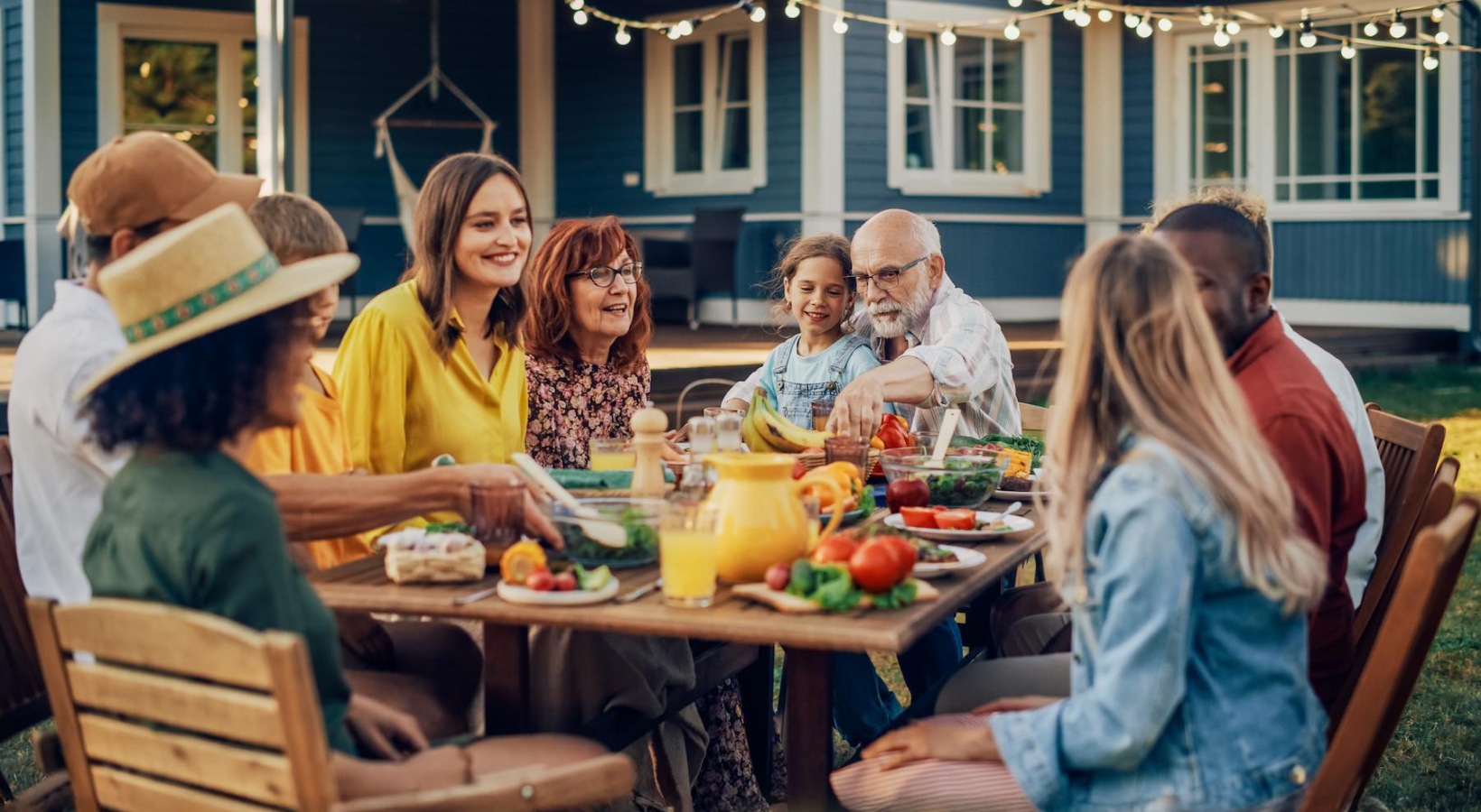 a family and friends dining together al fresco